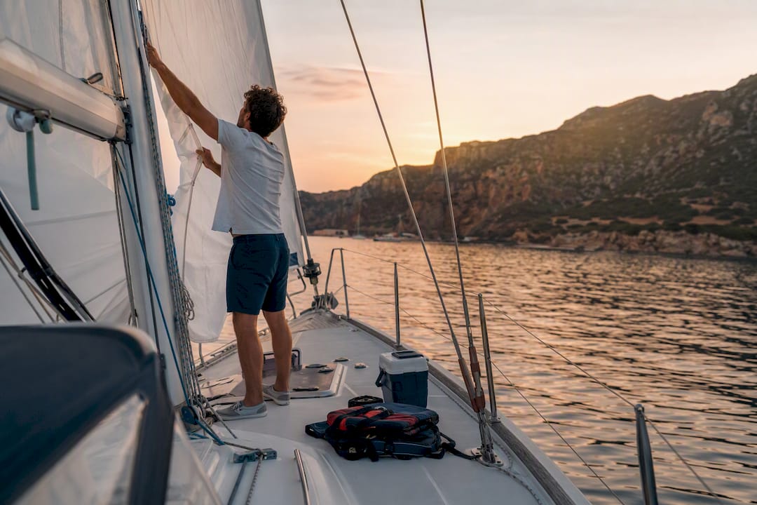Sailing yacht at marina dock at sunset