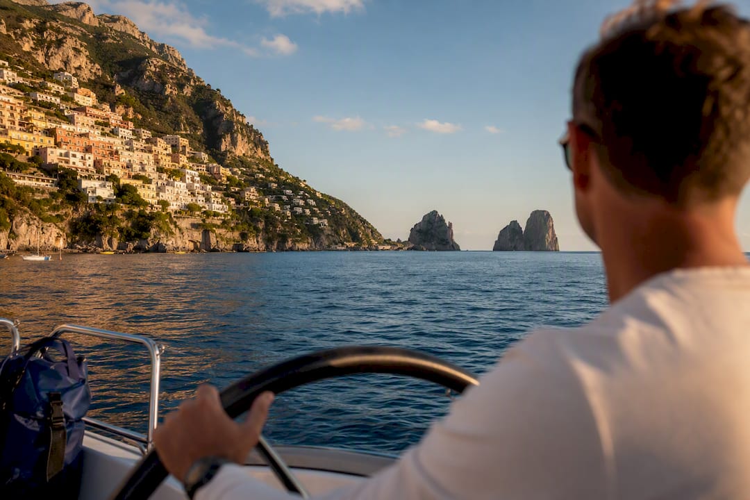 Skipper guiding a group along Amalfi Coast