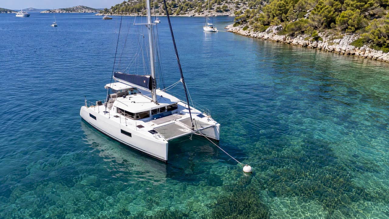 Charter catamaran using protected-area mooring buoy