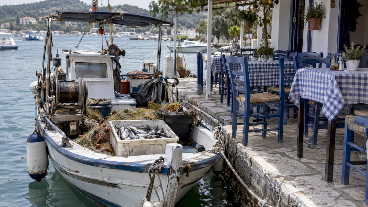 Fishing boat alongside Boukari waterfront taverna