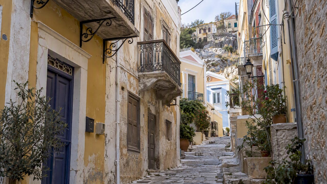 Neoclassical façades along a Symi town lane